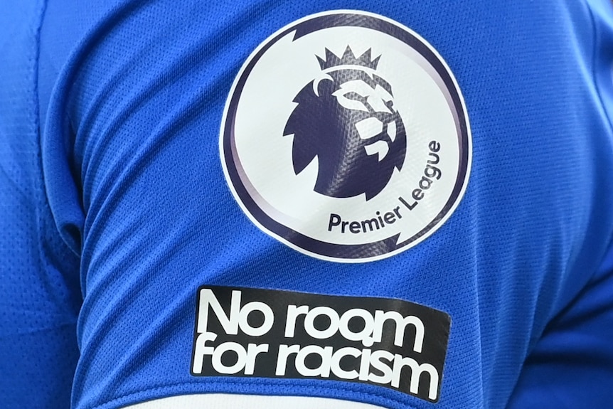The No Room for Racism logo is seen on a Premier League shirt