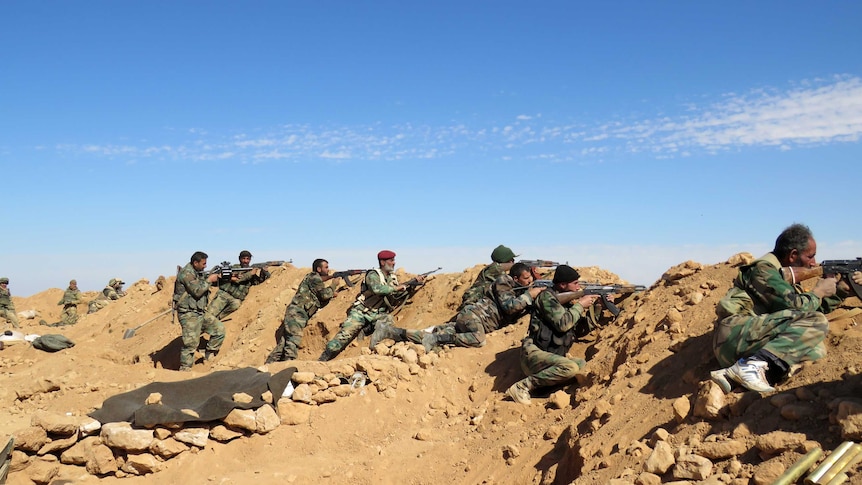 Syrian army soldiers on the outskirts of Syria's Raqqa region