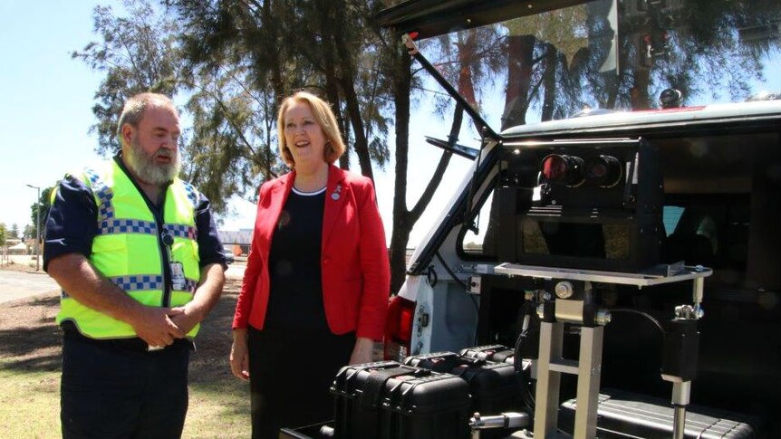 WA Police Minister Michelle Roberts, with a police officer display a boot speed camera, 29 December 2017
