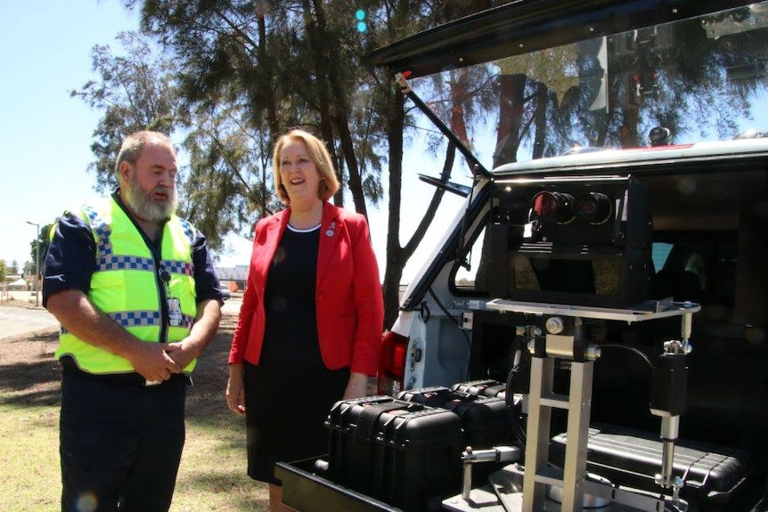 WA Police Minister Michelle Roberts, with a police officer display a boot speed camera, 29 December 2017