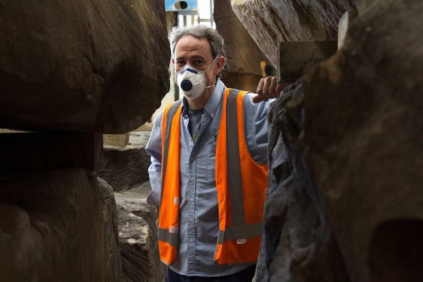 Paul Thurloe standing among stone blocks