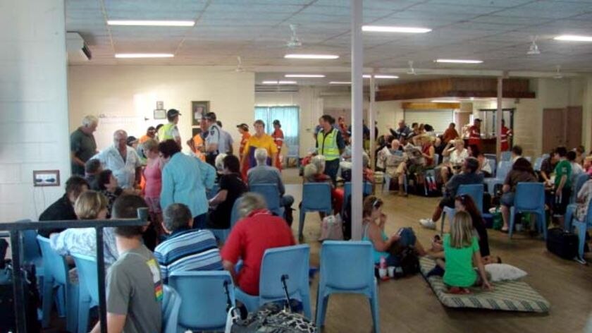 Passengers who were on the Sunlander train in a community hall after accident.