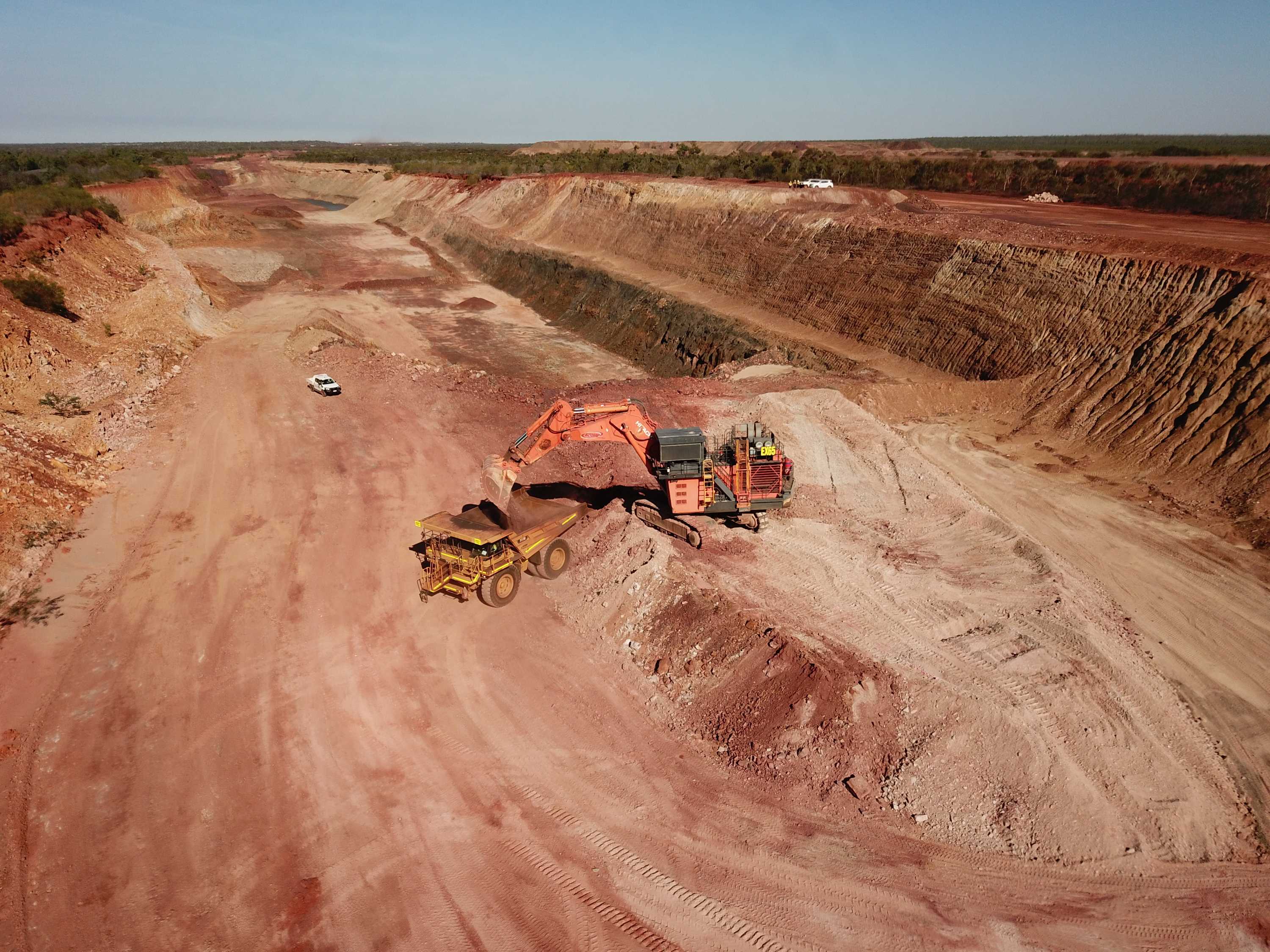 A haul truck is being loaded with iron ore in the open-pit of Roper Bar mine in the NT.