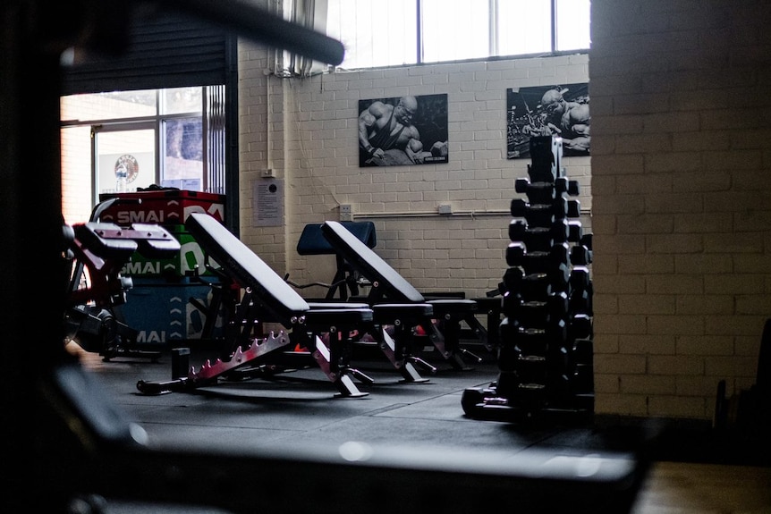 an empty gym with exercise equipment