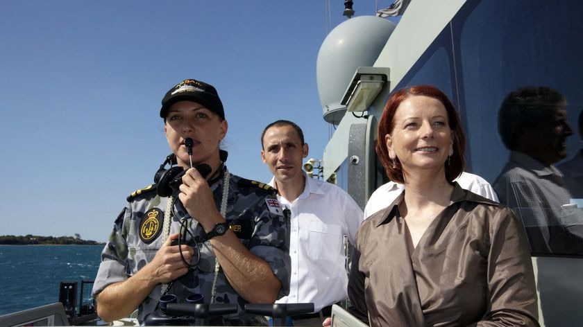 Prime Minister Julia Gillard and David Bradbury MP watch a vessel boarding exercise.