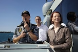 Prime Minister Julia Gillard and David Bradbury MP watch a vessel boarding exercise.