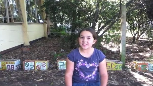 Girl sits in garden