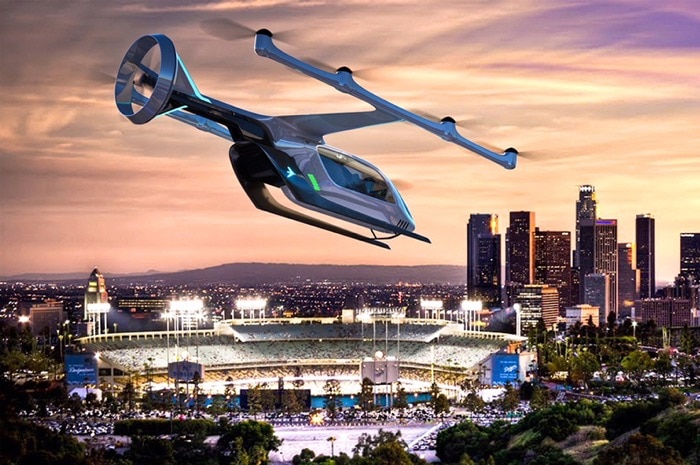 A flying vehicle sketched above a city skyline.