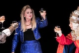 Colour production still of women toasting around a table on stage in 2018 Sydney Theatre Company production Top Girls.