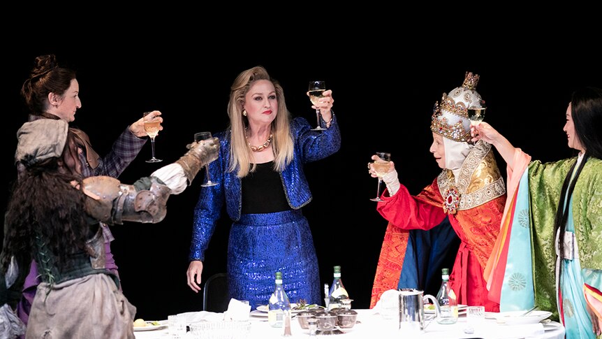 Colour production still of women toasting around a table on stage in 2018 Sydney Theatre Company production Top Girls.