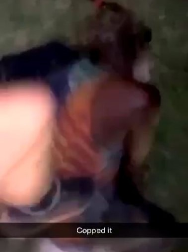 A screenshot of a boy kicking an Indigenous student.