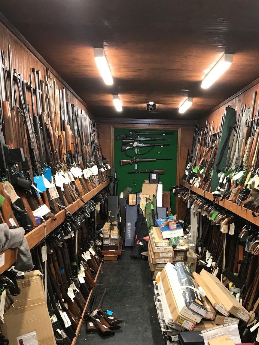 A firearm warehouse with 1180 guns lined on walls