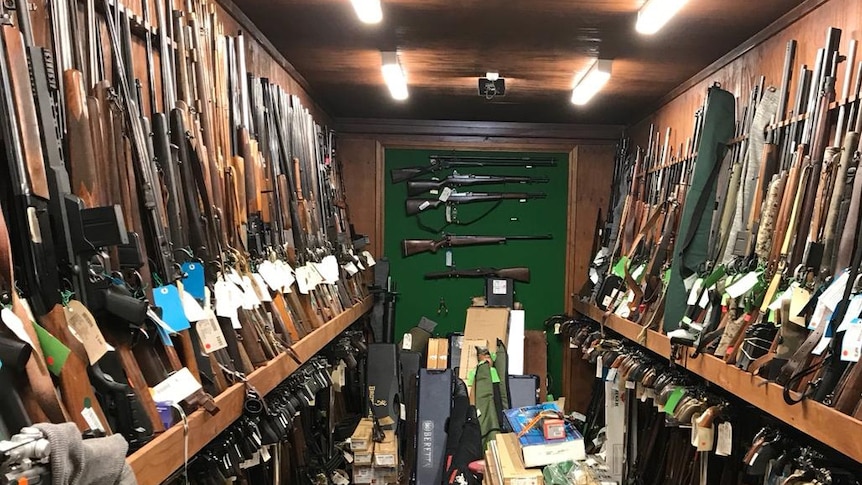 A firearm warehouse with 1180 guns lined on walls