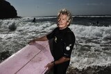 Midget Farrelly pictured with a surfboard at Sydney's Avalon Beach