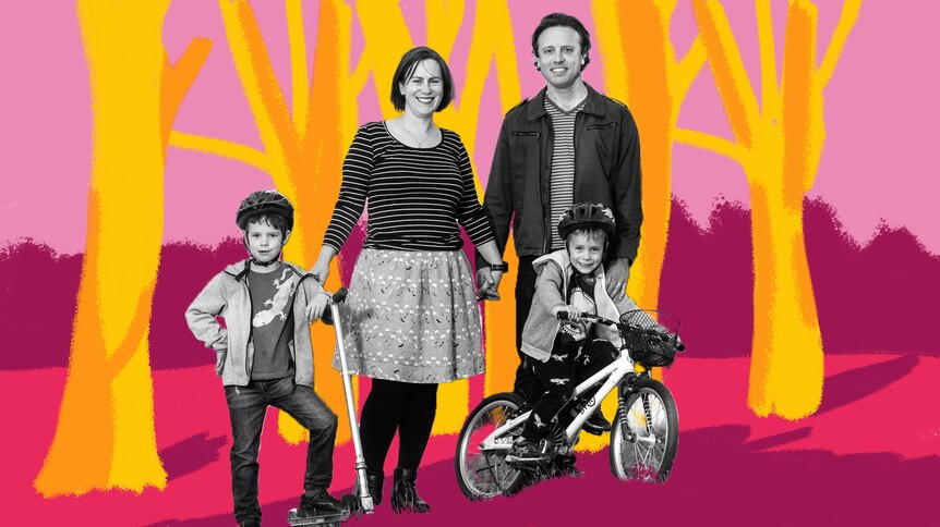 Family of two parents and two children standing in park with trees, representing the family's tree change to country Australia.