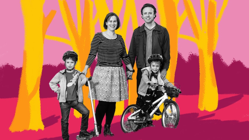 Family of two parents and two children standing in park with trees, representing the family's tree change to country Australia.