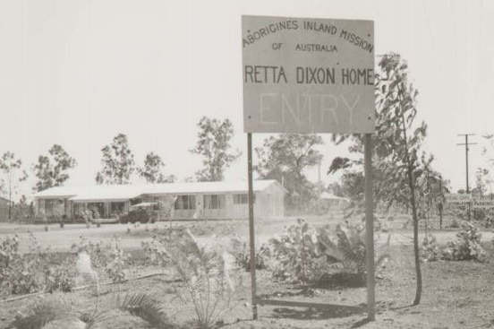 A historical photograph of the Retta Dixon Home in black and white.