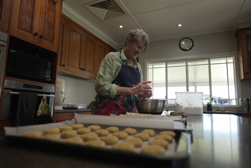 Photo of a woman cooking.