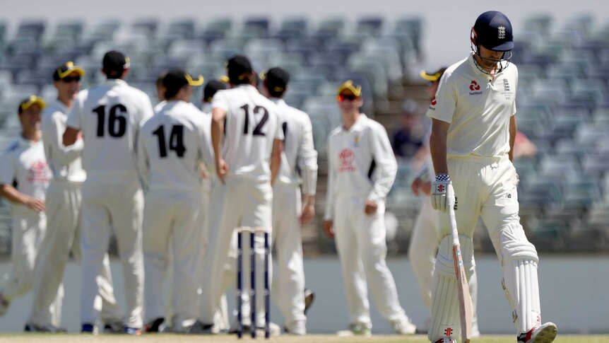 England's Alastair Cook leaves the field after being dismissed against Western Australia at WACA.