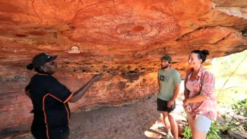 Tour guide Robyn Mungaloo shows tourists rock art in the Kimberley 29 June 2014