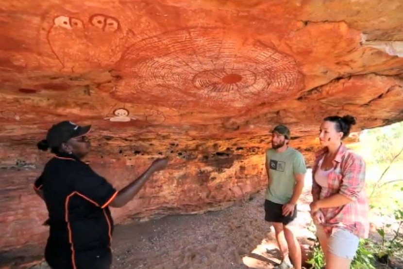 Tour guide Robyn Mungaloo shows tourists rock art in the Kimberley 29 June 2014