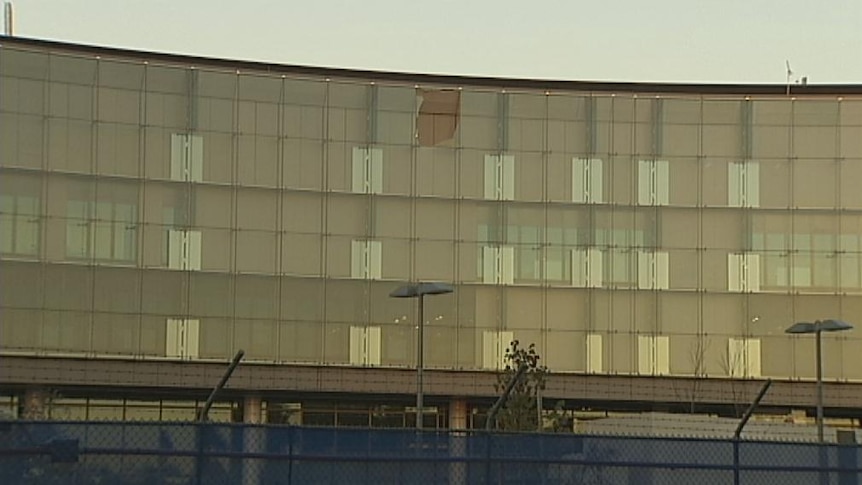 The pane of glass fell from the ASIO building at about 4:00pm AEST Thursday and no one was hurt.