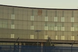 The pane of glass fell from the ASIO building at about 4:00pm AEST Thursday and no one was hurt.