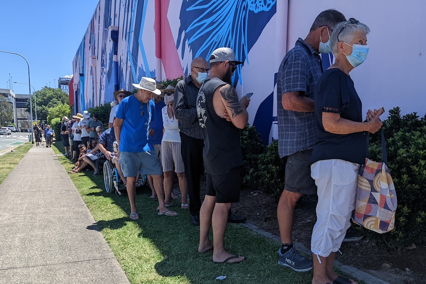 People in line for COVID-19 booster shots on the Sunshine Coast at a Maroochydore shopping centre