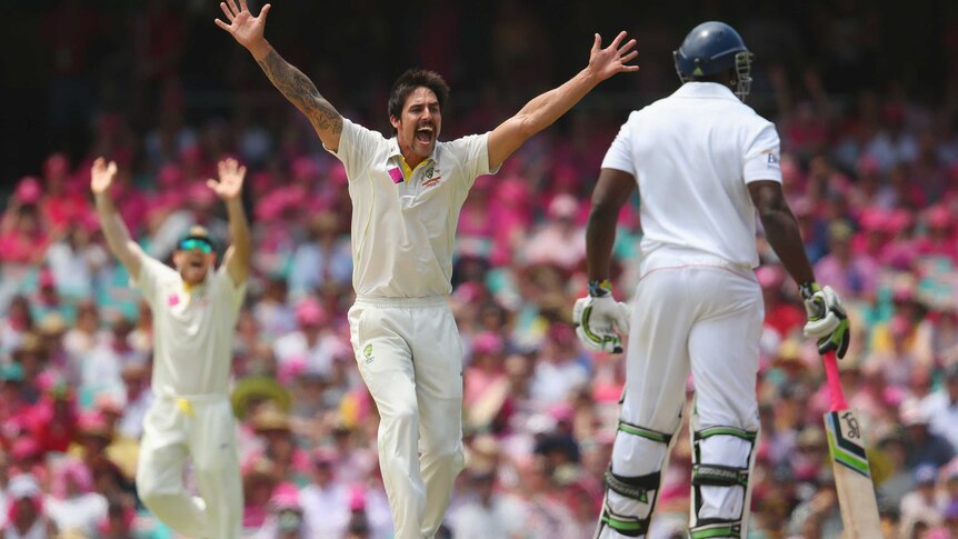 Mitchell Johnson appeals successfully for the wicket of England captain Alastair Cook at the SCG