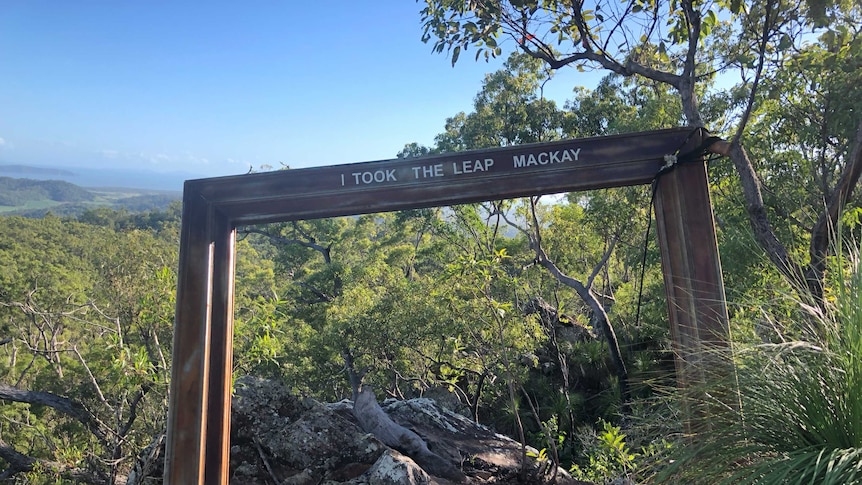 A sign in front of a view