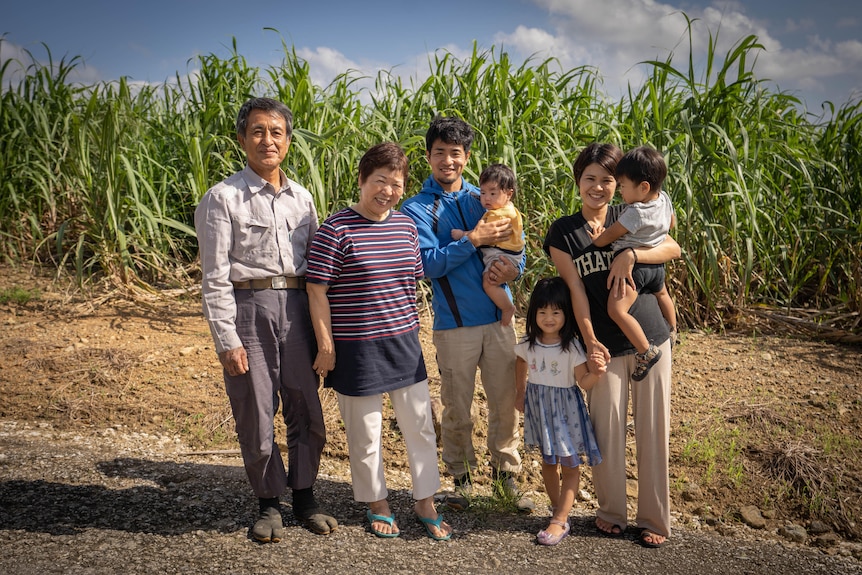Ryutaro and his family at their farm.