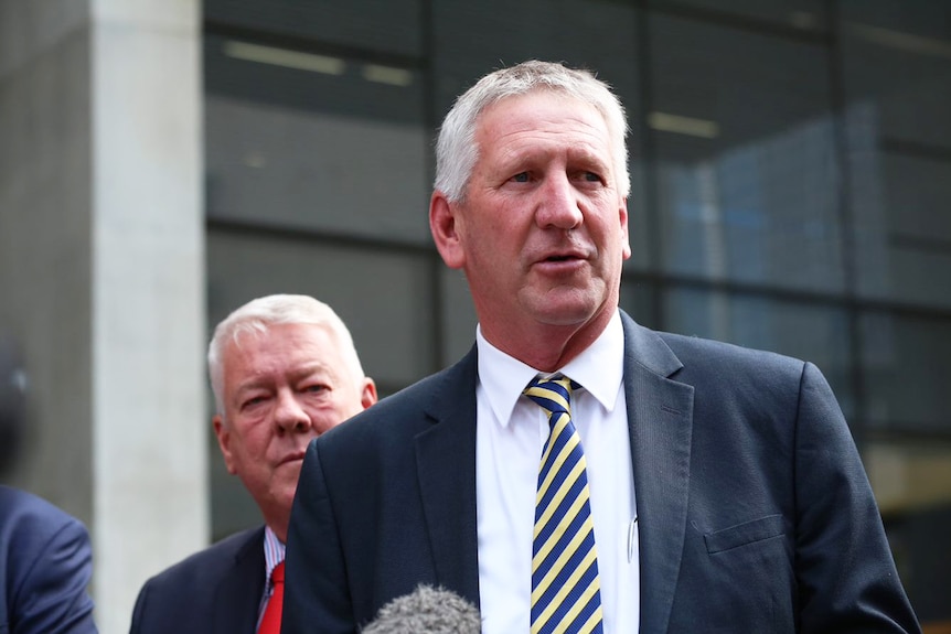 Denis Wagner speaks outside the Supreme Court in Brisbane.