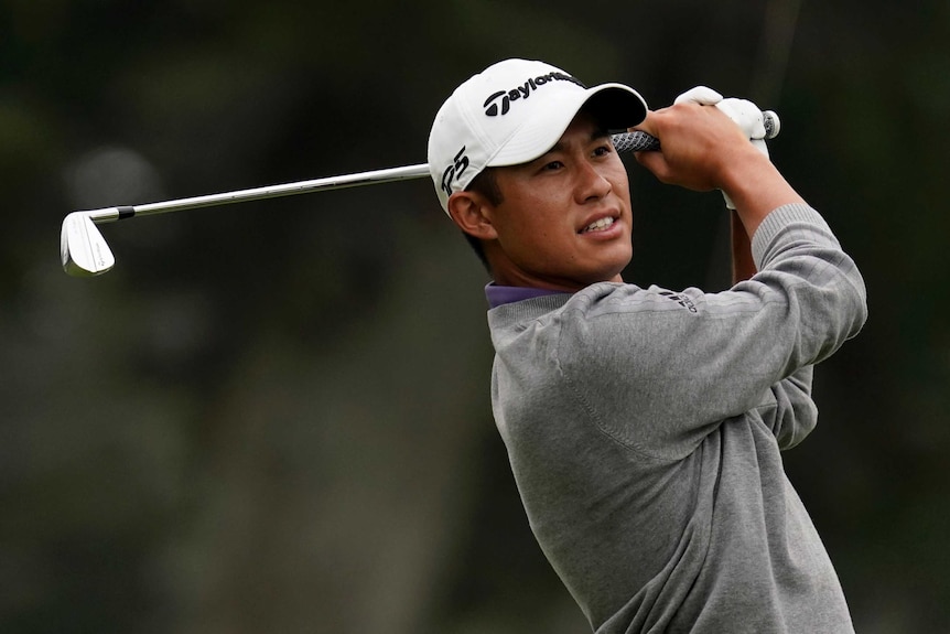 Golfer Collin Morikawa completes his swing at the PGA Championship.