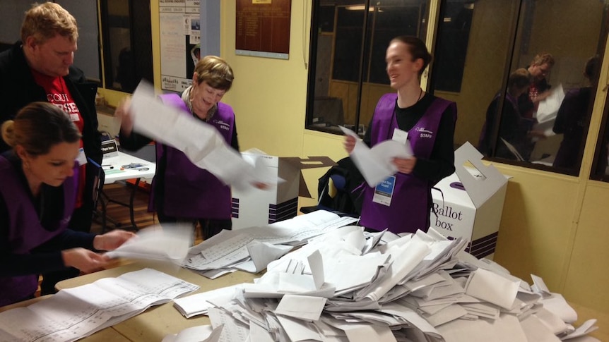 Senate ballot papers are sorted in the electorate of Petrie on July 2, 2016.