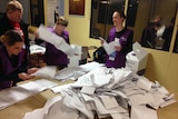 Senate ballot papers are sorted in the electorate of Petrie on July 2, 2016.