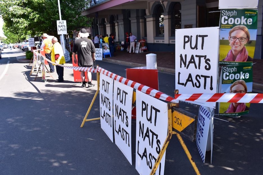 Signs saying 'Put Nats Last'