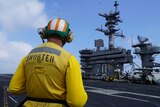 A crew member on board the US aircraft carrier Carl Vinson in the South China Sea.