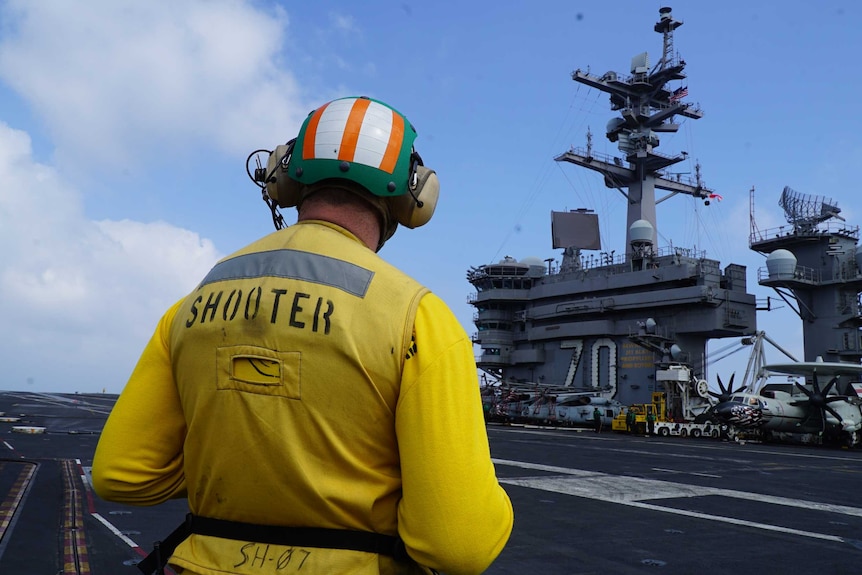 A crew member on board the US aircraft carrier Carl Vinson in the South China Sea.