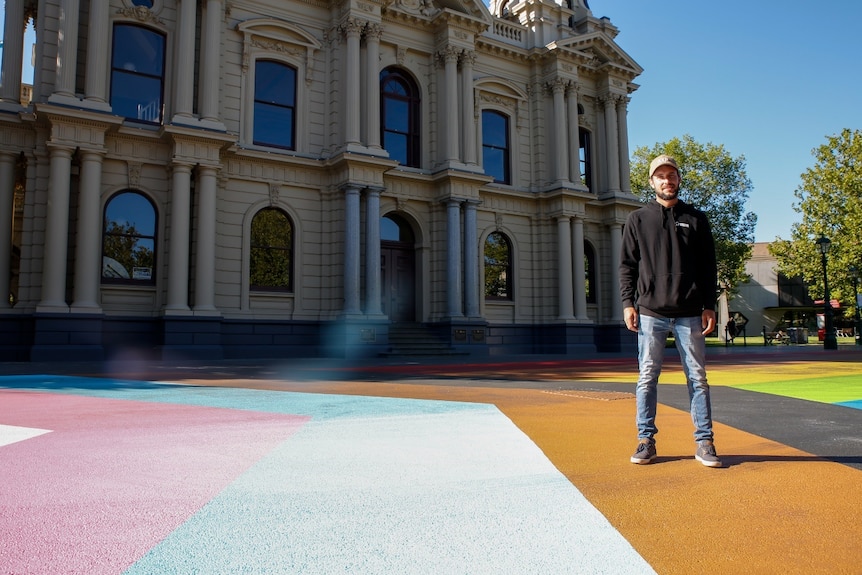 A person standing in front of a building