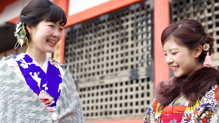 Two Japanese women in tradition dress in conversation