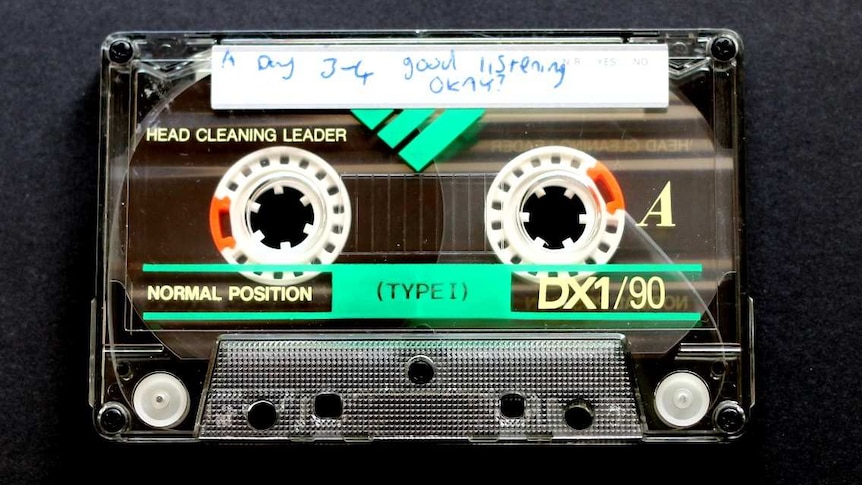 An image of a cassette tape recorded by Justin Heazlewood as a child, titled 'Good listening okay?'.