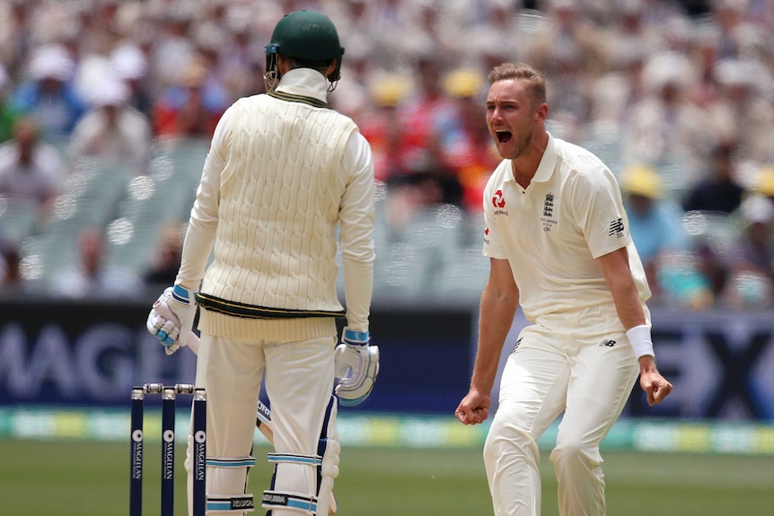 Stuart Broad celebrates in front of Australia's Peter Handscomb