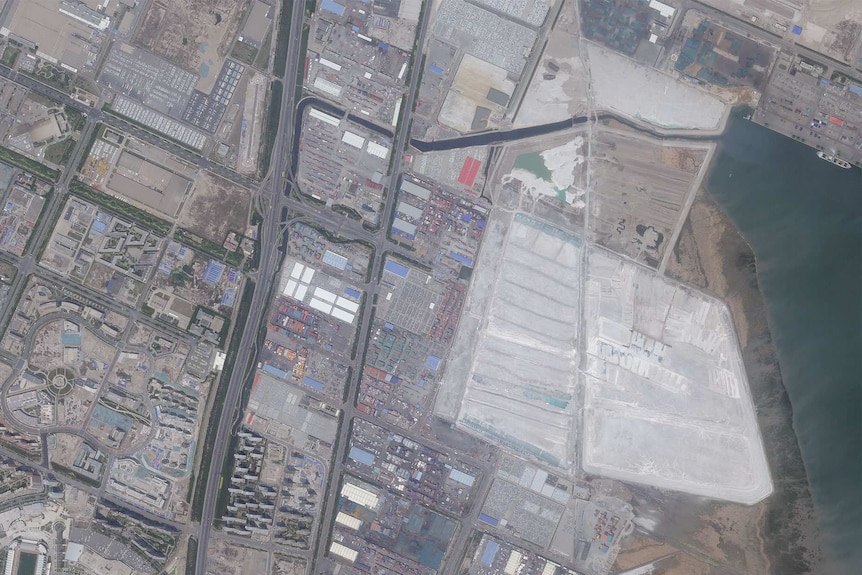 A satellite image shows the Chinese port city of Tianjin before two massive blasts that ripped through an industrial area.