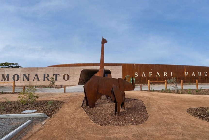 A photograph of the Monarto Safari Park entrance with animal statues in foreground. 