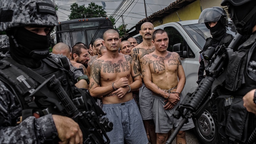 Members of MS13 are handcuffed by police in Central America.