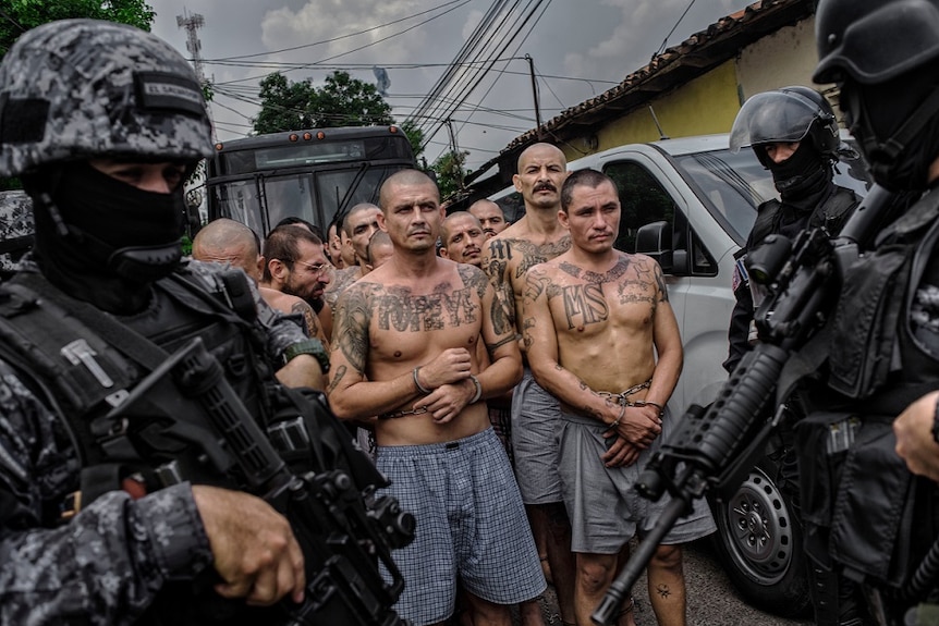 Members of MS13 are handcuffed by police in Central America.