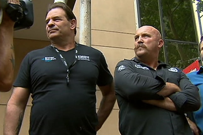 John Setka (left) and Shaun Reardon standing outside a building.