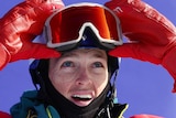 Australian snowboarder Scotty James looks up at the scoreboard at the Winter Olympics as he lifts his goggles off his face.