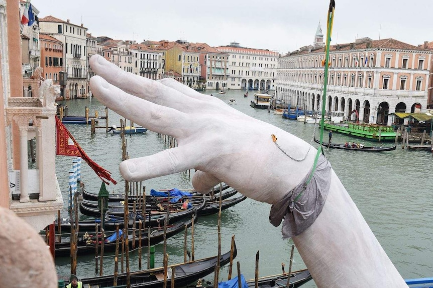 Support by Lorenzo Quinn being assembled