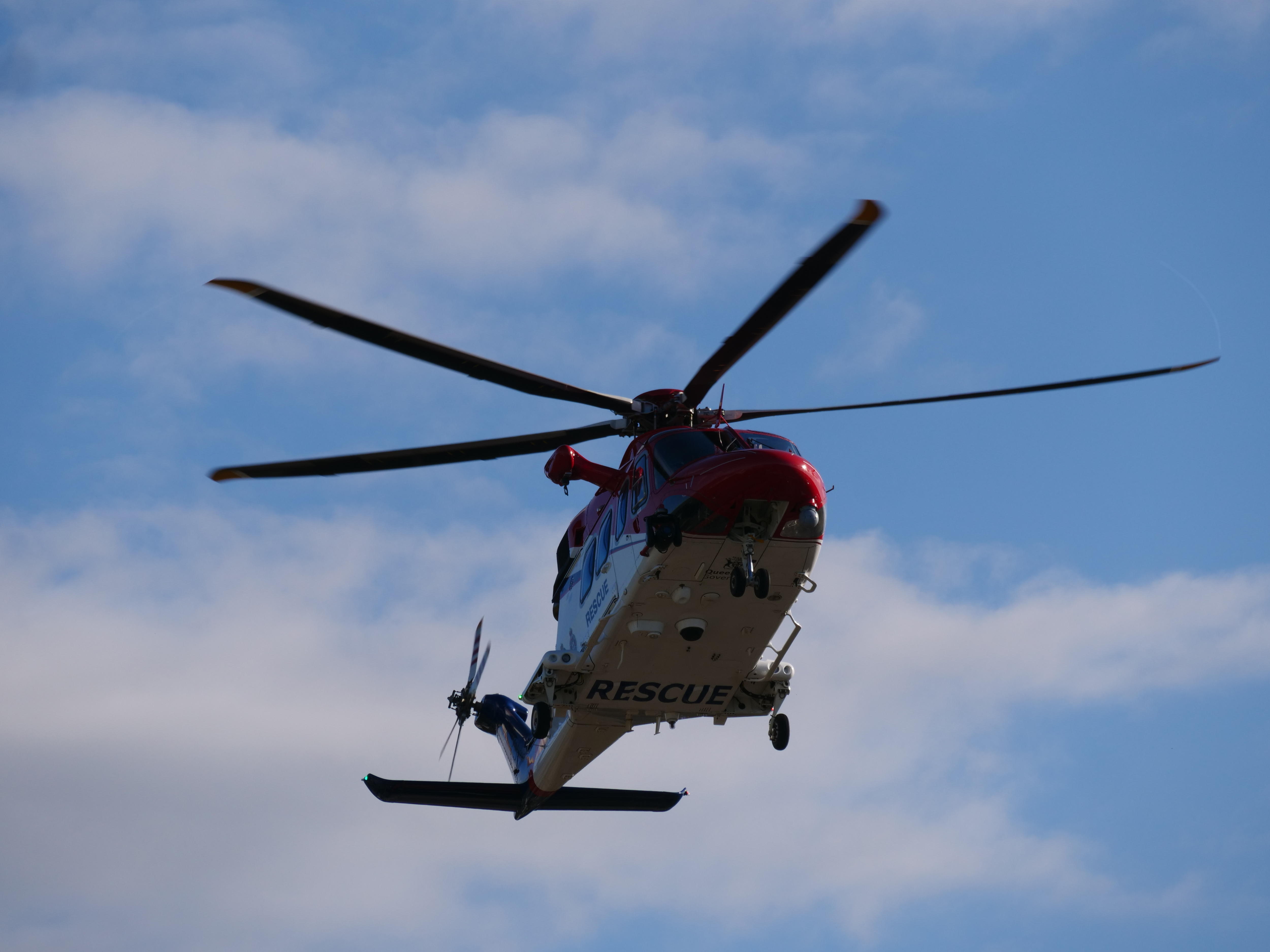 A helicopter carrying patients injured in the crash lands at Townsville University Hospital.